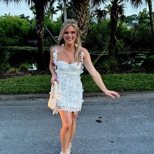 White mini dress with a corset and petals